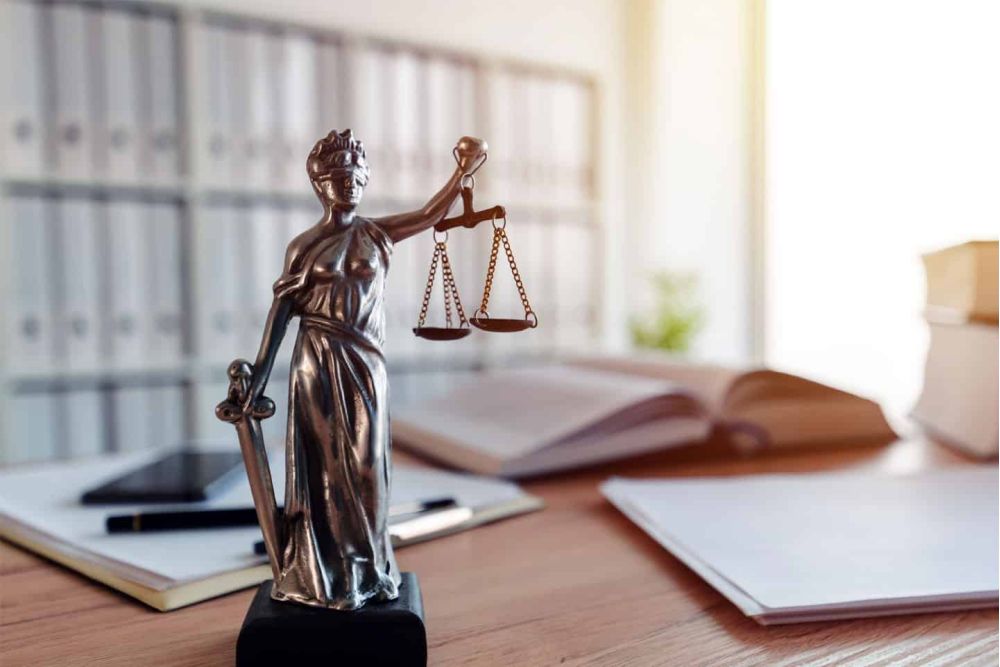 image of lady of liberty with scales in a law office