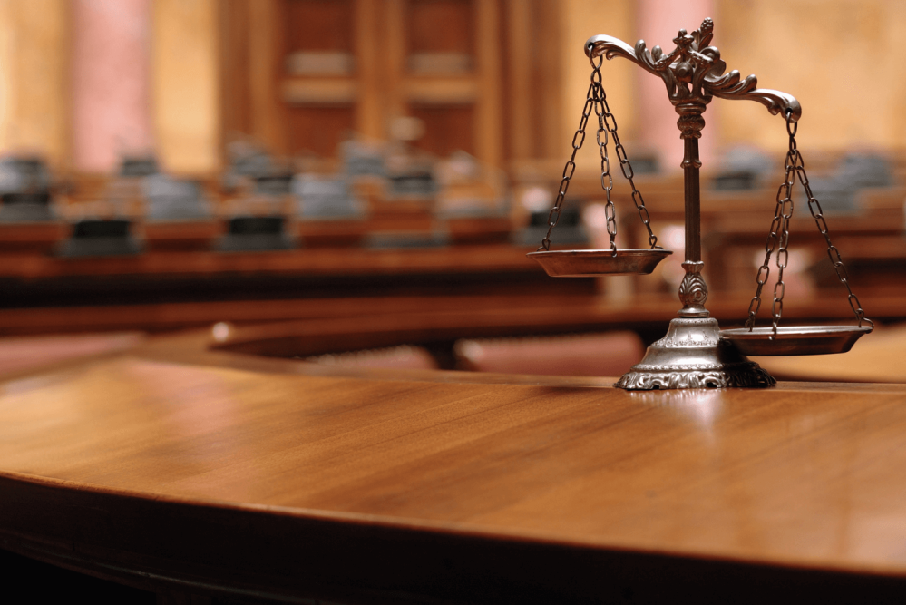 image of legal scales in a courtroom
